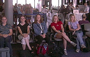 KATIE. KATIE, LINDSAY, KRISTEN, AND MARAE WAITING TO BOARD THE PLANE